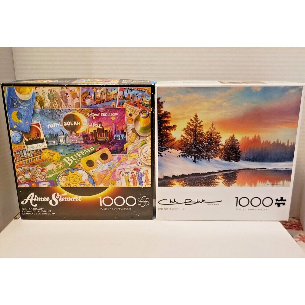 Lot 2  Puzzles 1000 piece each w/ Posters Path of Totality, One Quiet Morning